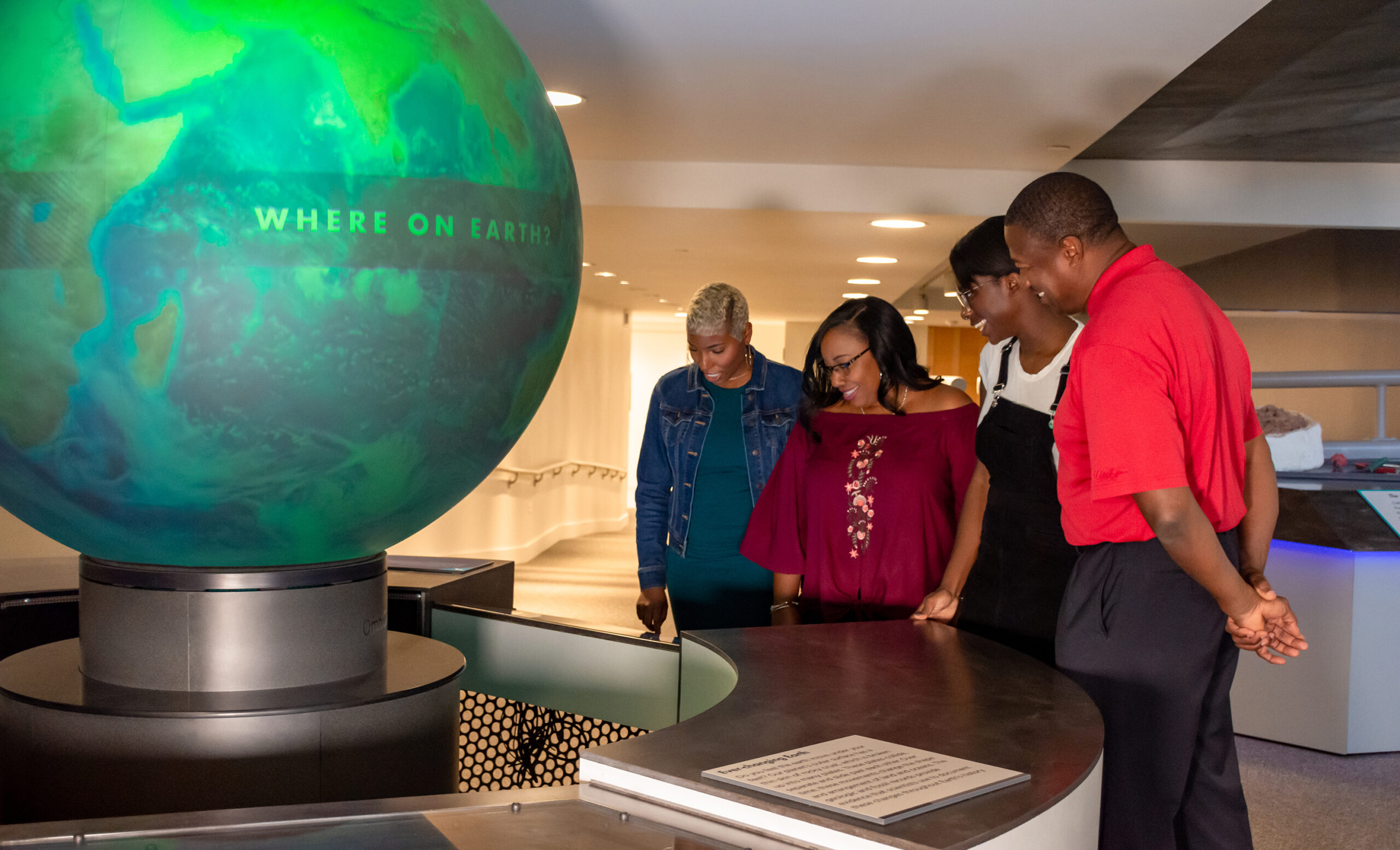 Planned Gifts Image of family in the Museum of Natural History & Science